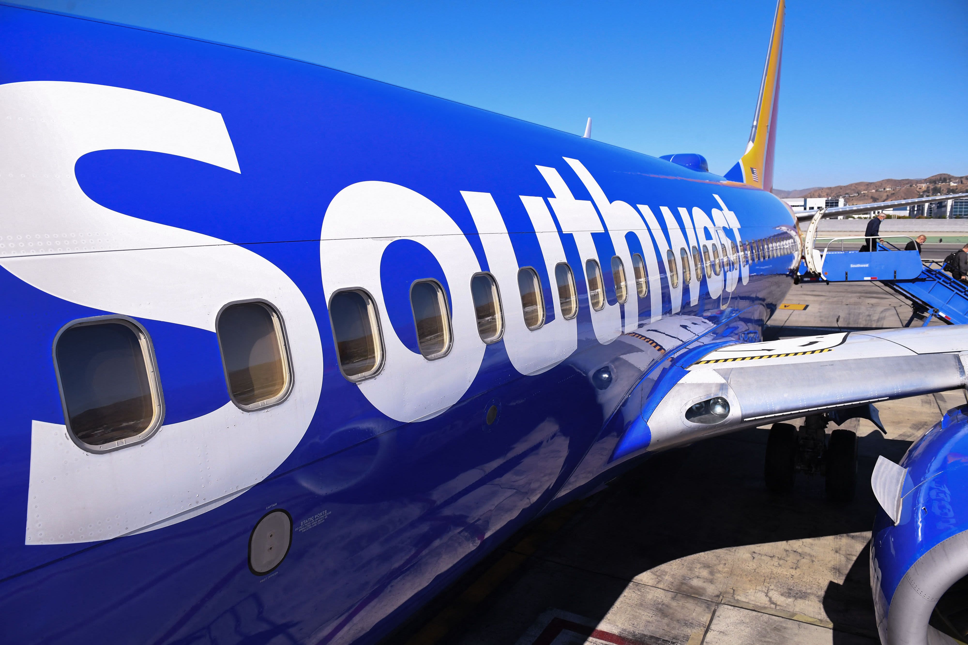 Passengers deplane from a Southwest Airlines flight from Las Vegas at Hollywood Burbank Airport in Burbank, California, Oct. 10, 2021. Southwest Airlines canceled more than 1,000 flights Sunday, as part of a major weekend service disruption that the carri