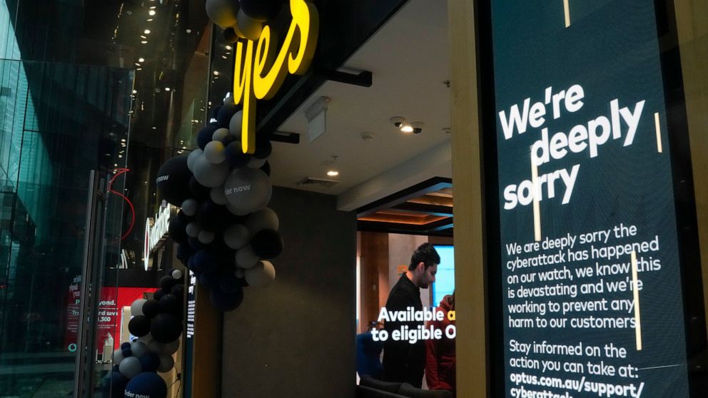 Electronic signage at an Optus telecommunications retail store is seen at the central business district of Sydney, Australia, Wednesday, Oct. 5, 2022. The government has announced changes to telecommunications law, Thursday, Oct. 6 to protect custome